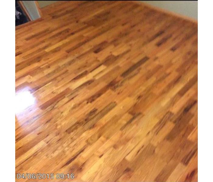 Hardwood floor restored after water damage