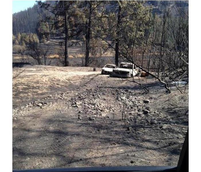 burned woodlands and burned car